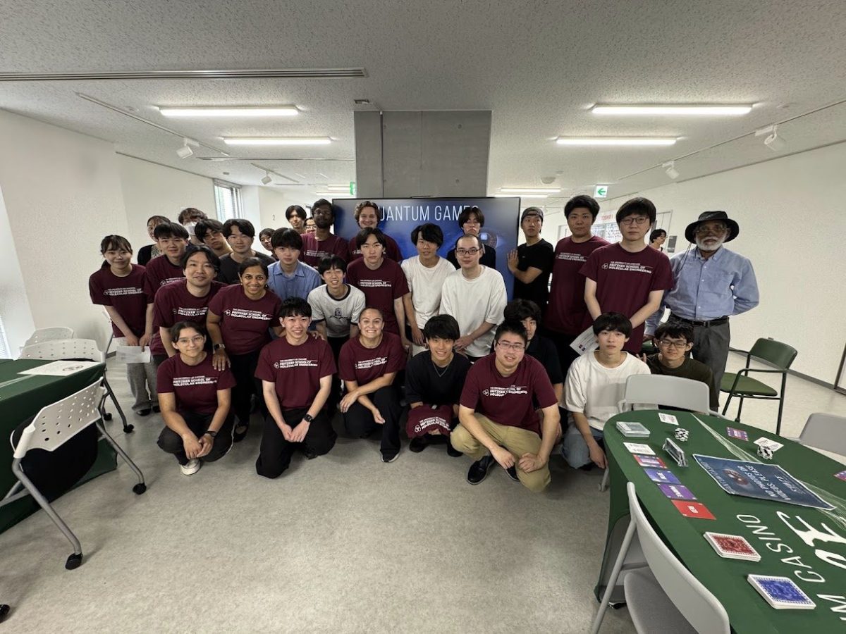 STAGE Center members and Tohoku University students at the Quantum Games exhibit during Tohoku University Open Campus 2026